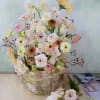 Natural and garden like yet elegant arrangement in a decorative container made