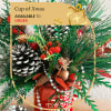 This festive Christmas cup arrangement radiates holiday cheer with its vibrant and
