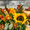 A lovely collection of fall flowers with touches of indian corn, mini