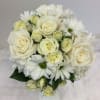 All white handheld bouquet with a mix of roses, spray roses, carnations