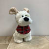 This fluffy, white plush dog is sure to charm with his floppy