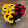 sunflowers with red and black roses arranged inside a heart box with