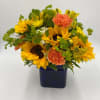 BLUE CUBE WITH SUNFLOWERS, CARNATIONS, ALSTROEMERIA, AND MISC FILLERS
