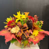 A mix of roses and tropical flowers that make this Thanksgiving model