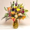 This stunning fall-inspired design bursts with the rich, warm colors of the