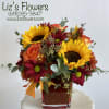 Fall color flowers in cube. 