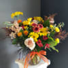 A beautifully selected bunch of the freshest flowers in a vase uniquely