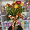 dozen yellow flowers in fall setting 