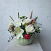 Simply but elegant green pumpkin with white roses, green button chrysanthemums, and