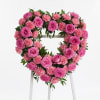 Exquisite heart-shaped arrangement of pink roses, elegantly crafted to celebrate any occasion