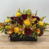 This sophisticated design and bold color combination of cymbidium orchids, spray roses