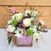 Celebrate the joy of a new baby girl with this delightful arrangement