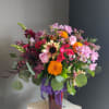 A beautiful one of a kind arrangement made with fresh flowers in