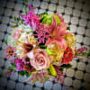 So pretty, this lush little arrangement, presented in a clear glass vase