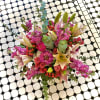 So pretty, this lush little arrangement, presented in a clear glass vase