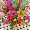 So pretty, this lush little arrangement, presented in a clear glass vase