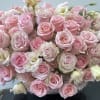 A full and lush design featuring elegant ivory lisianthus paired with roses