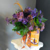 A dozen of our roses with orange baby&#039;s breath and a festive