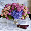 Majestic and magical. Exciting and Elegant. This jewel toned flower centerpiece is