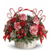 Carnation white and red with Christmas candies. 
Basket color is subject to