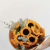 A classic bouquet of fresh sunflowers, beautifully wrapped in soft neutral paper.