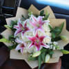 White Roses, Stargazers in the center and on the outer edges. Wrapped