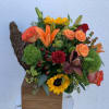 A beautiful fall arrangement in a cornucopia. Perfect for centerpieces or to