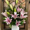 A beautiful engraved vase with oriental lilies.
Lilies can be white or pink