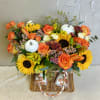 Captivating like a summer sunset, this stunning arrangement of vibrant roses is