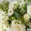 A sweet and elegant asymmetric arrangement of all whites and neutral flowers