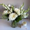 A sweet and elegant asymmetric arrangement of all whites and neutral flowers