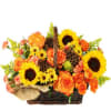 This wicker basket is filled with fresh sunflowers, roses, solidago, and accented