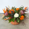 Some of our fall favorites of marigold, protea, roses, and birds of