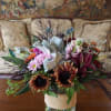 Lovely vase full of rich fall tone arrangement. A carefully selected mix