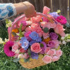 Absolutely adorable basket holds gorgeous spring hue&#039;s of flowers. A great gift