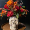 Beautiful ceramic skull with seasonal fall flowers 