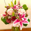 This elegant modern design includes a variety of premium blooms. Such as