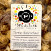 Holy Moly! Handcrafted caramel cheesecake popcorn and candied pecans coated with white