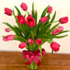 This simple yet classic vase arrangement includes 15 tulips in a clear