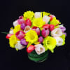 A beautiful floral arrangement with bright tones full of joy with tulips