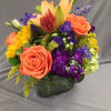 A Mixture of beautiful fall blooms arranged in a cube. A perfect