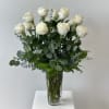 This arrangement is a bouquet of one dozen premium white roses with