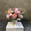 Colorful vase with &#039;Lets Celebrate&quot; filled with Lisianthus, pink roses, snap dragons