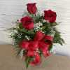 A 3 rose vase with a mixture of filler flower and a