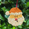 Wooden Christmas &ldquo;cookies&rdquo; coated in seed and treats. Have your birds been