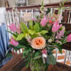 Dutch tulips, orchids, lisianthis, roses, hydrangea, astilble and fillers arranged in a