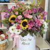 This box includes a variety of flowers including roses, tulips, sunflowers and