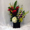 Exotic piece in a square ceramic vase with red gingers, hydrangea, cymbidium