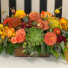 Fall colored flowers, roses, and orchids in a wood box. Specific flowers