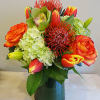 A modern spring mix of florals in lime green &amp; tangerine. Tulips
